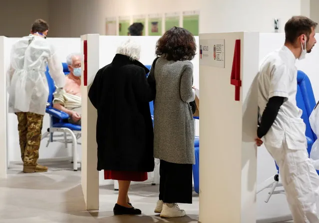 People arrive to receive a dose of the Moderna vaccine against the coronavirus disease (COVID-19) at the Music Auditorium in Rome, Italy, April 14, 2021. (Photo by Yara Nardi/Reuters)