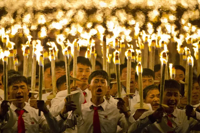 North Korean students take part in a torch light march held in conjunction with the 70th anniversary of North Korea's founding day celebrations in Pyongyang, North Korea, Monday, September 10, 2018. (Photo by Ng Han Guan/AP Photo)