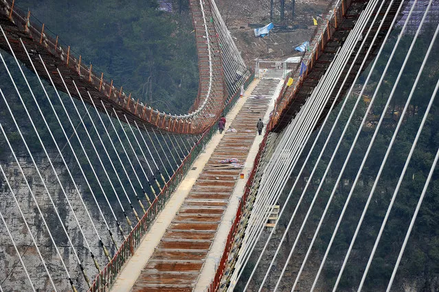 View of the world's longest and highest glass-bottomed bridge under construction over the Zhangjiajie Grand Canyon at Wulingyuan Scenic and Historic Interest Area in Zhangjiajie city. The skywalk spanning the Zhangjiajie Grand Canyon is set to open to the public in May 2016. So for those die-hard Avatar fans out there, soon you will be able to see the inspiration behind James Cameron's Pandora like you've never seen it before. (Photo by Imaginechina /Splash News)