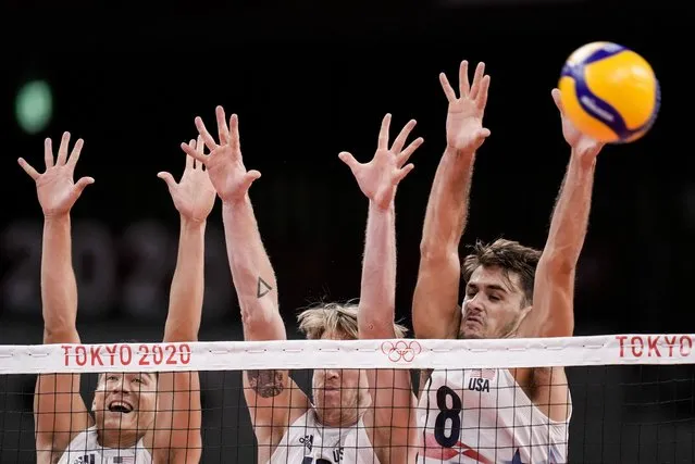 United States' Torey Defalco, right, blocks the ball during the men's volleyball preliminary round pool B match between United States and Russian Olympic Committee at the 2020 Summer Olympics, Monday, July 26, 2021, in Tokyo, Japan. (Photo by Manu Fernandez/AP Photo)