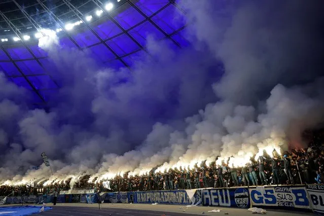 Fans of Hertha Berlin light flares in the stands during the Second Bundesliga match between Hertha BSC and Karlsruher SC at Olympiastadion on November 11, 2023 in Berlin, Germany. (Photo by Maja Hitij/Getty Images)