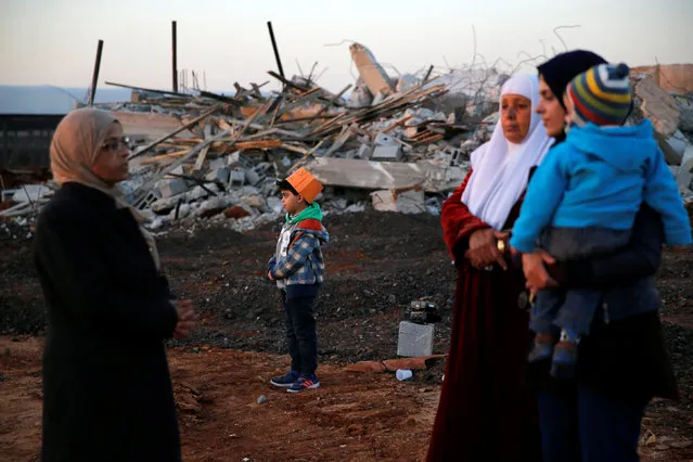 Israeli Arabs stand near the rubble of houses demolished by Israeli bulldozers in the northern Israeli city of Qalansuwa January 11, 2017. (Photo by Ammar Awad/Reuters)