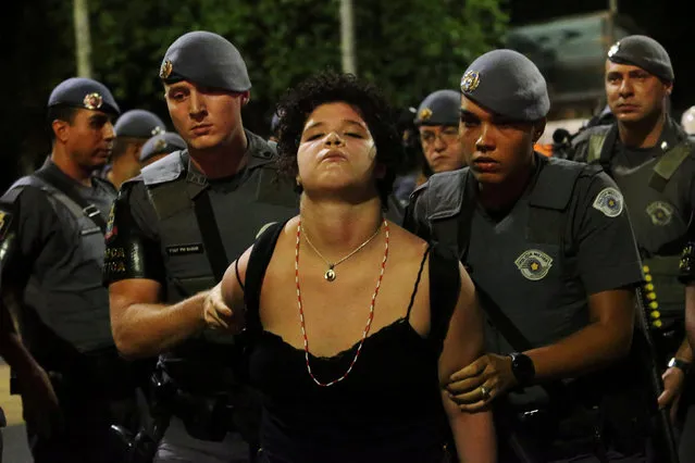 Riot police detain a demonstrator during a protest against fare hikes for city buses in Sao Paulo, Brazil January 22, 2019. (Photo by Amanda Perobelli/Reuters)