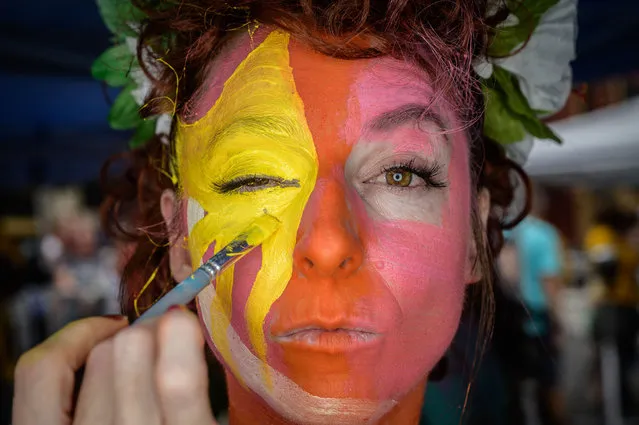 Participant Tricia Storie poses for a portrait after being painted during the annual NYC Bodypainting Day at Union Square in New York on July 25, 2021. The annual self-titled event aims to promote acceptance and the “use of the human form as an aesthetic versus personal identity”. (Photo by Ed Jones/AFP Photo)