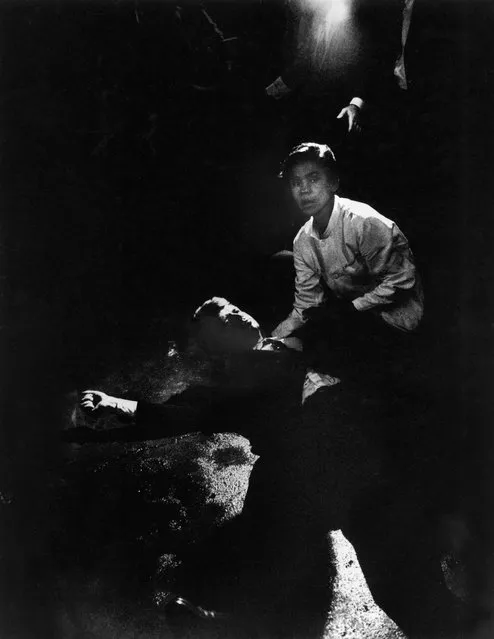 Senator Robert Kennedy sprawled semi-conscious in his own blood after being shot in brain and neck while busboy Juan Romero tries to comfort him, in kitchen at hotel, on June 06, 1968. (Photo by Bill Eppridge/The LIFE Picture Collection/Getty Images)