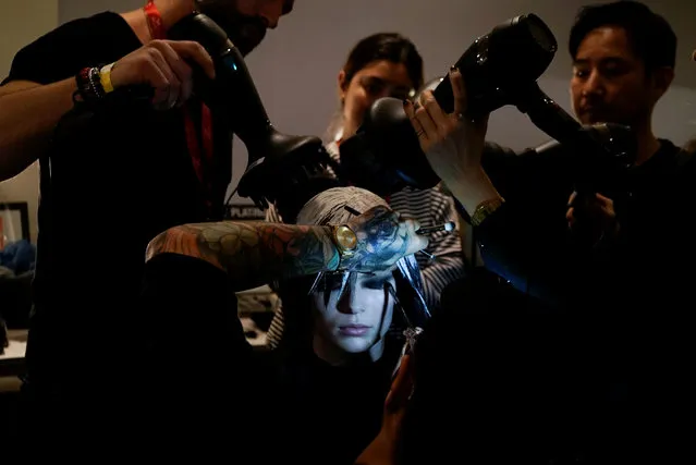 A model sits for hair style and makeup before the Jeremy Scott show during New York Fashion Week in New York, U.S., February 8, 2019. (Photo by Gaia Squarci/Reuters)