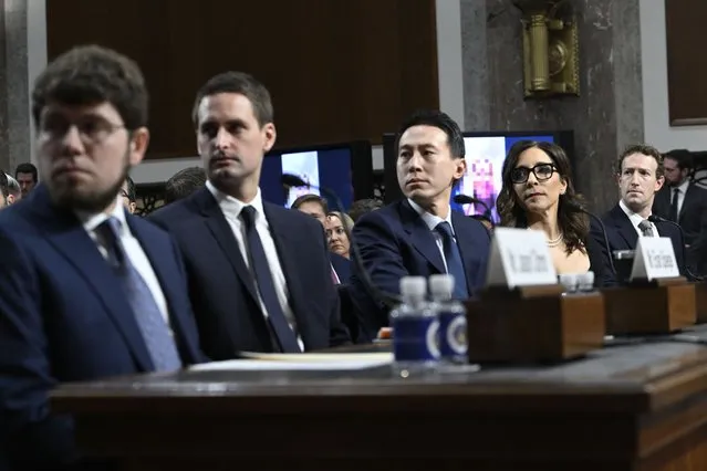 (L-R) Jason Citron, CEO of Discord; Evan Spiegel, CEO of Snap; Shou Zi Chew, CEO of TikTok; Linda Yaccarino, CEO of X; and Mark Zuckerberg, CEO of Meta, watch a video of victims before testifying at the US Senate Judiciary Committee hearing, “Big Tech and the Online Child Sexual Exploitation Crisis”, in Washington, DC, on January 31, 2024. (Photo by Andrew Caballero-Reynolds/AFP Photo)