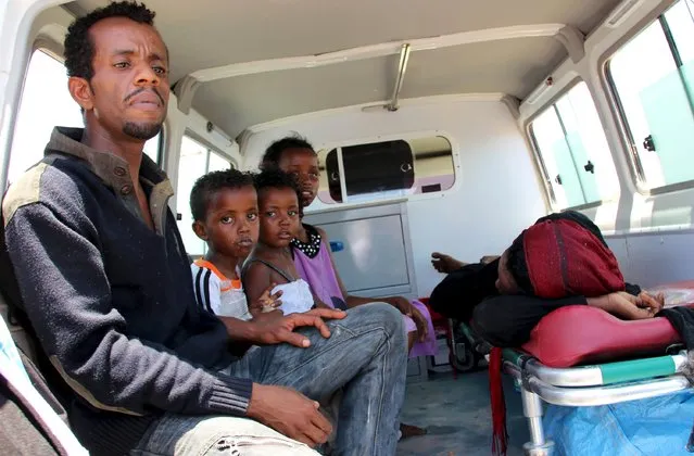 A Somali family waits in an ambulance with a relative injured from the ongoing violence in Yemen, as they arrive at the port of Bosasso in Somalia's Puntland region, April 26, 2015. (Photo by Abdiqani Hassan/Reuters)