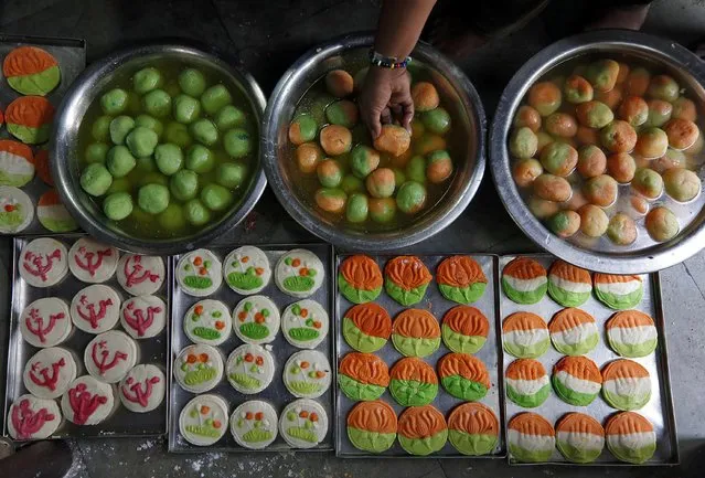 Sweets featuring election symbol of different Indian political parties are pictured inside a sweets making workshop on the outskirts of Kolkata, India, March 20, 2019. (Photo by Rupak De Chowdhuri/Reuters)