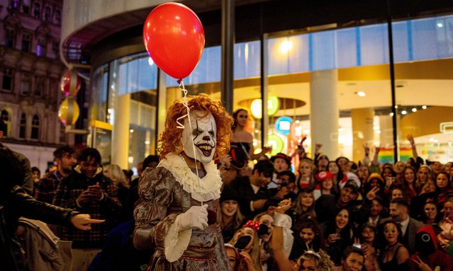 A man seen dressed up as Pennywise the dancing clown during the Halloween Eve on October 30, 2021in Central London. It has been more than a year since the COVID-19 pandemic where social interaction with other people are restricted. (Photo by Hesther Ng/SOPA Images/Rex Features/Shutterstock)