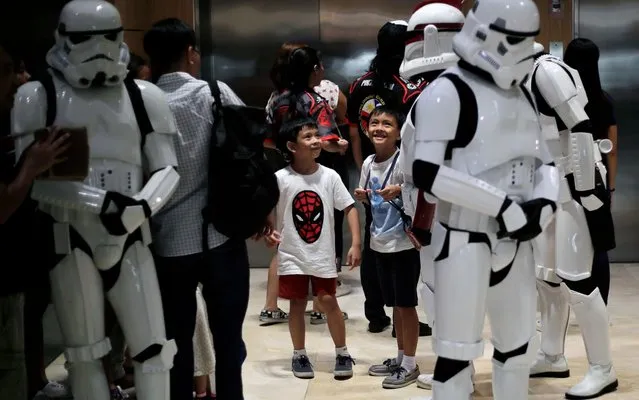 Two boys smiles as Filipino fans wearing Stormtroopers costumes attend a Star Wars Day celebration inside a shopping mall in Taguig city, south of Manil, Philippines, 04 May 2019. Star Wars Day is celebrated every 04 May by many fans in different parts of the world. (Photo by Francis R. Malasig/EPA/EFE/Rex Features/Shutterstock)