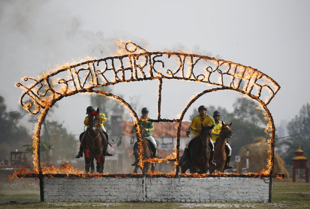 Nepalese Army soldiers demonstrate their skills during the “Ghodejatra” Horse Race festival, organised by the Nepal Army, in Kathmandu, Nepal, April 7, 2016. (Photo by Navesh Chitrakar/Reuters)