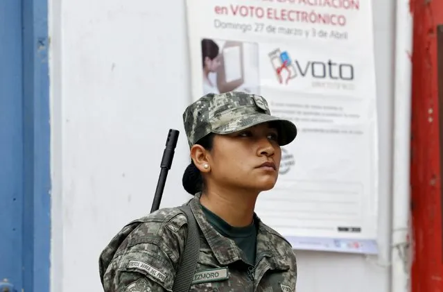 Peruvian soldier patrol a polling station after workers of Peru's National Office of Electoral Processes (ONPE) leave voting materials, in Surco, ahead of Sunday's presidential election in Lima, April 9, 2016. (Photo by Mariana Bazo/Reuters)