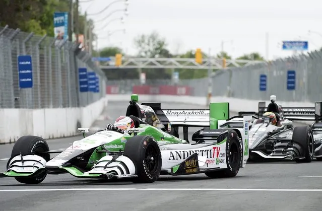 Carlos Munoz, of Colombia, makes a corner during practice for the IndyCar auto race, Friday, June 12, 2015, in Toronto. (Nathan Denette/The Canadian Press via AP)