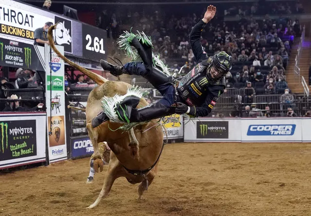 Bull rider Derek Kolbaba competes on Cutthroat during the second round of the PBR Unleash The Beast Monster Energy Buckoff at Madison Square Garden in New York, January 8, 2022. (Photo by Timothy A. Clary/AFP Photo)