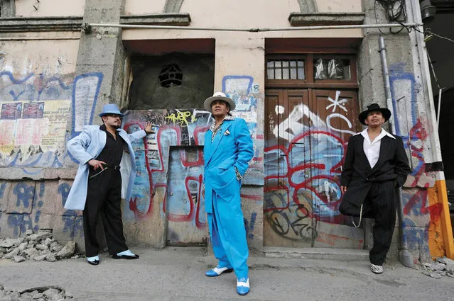 Kitted out in zoot suits, snappy shoes and hats, the so-called “pachucos” add a dash of style to the Mexican capital. The “pachuco” scene is thought to date back to the 1930s and 40s in Los Angeles, where Mexican migrants would wear the snazzy outfits, partly as a symbol of defiance against discrimination. Many modern Pachucos in Mexico follow on from this custom and use the suits not only to go dancing, but also as a continuing sign of protest against the treatment of Mexican immigrants north of the border. (Photo by Henry Romero/Reuters)