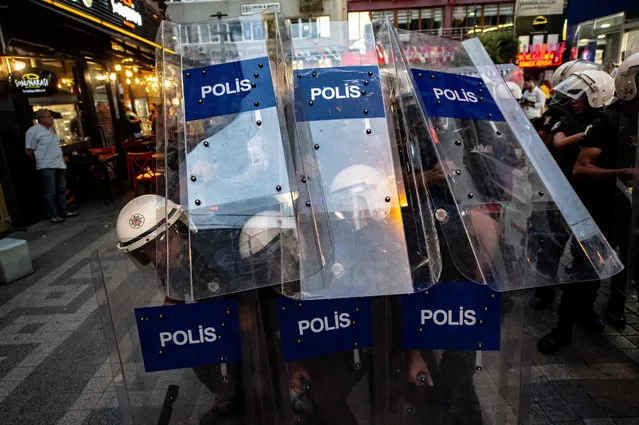 Turkish police holding their shields gather during a demonstration against the replacement of Kurdish mayors with state officials in three cities, on August 20, 2019, in Istanbul. The Turkish government removed three mayors from office on August 19 over alleged links to Kurdish militants as Ankara deepened its crackdown on the opposition. The mayors of Diyarbakir, Mardin and Van provinces in eastern Turkey – all members of the pro-Kurdish Peoples' Democratic Party (HDP) elected in March – were suspended over alleged ties to the outlawed Kurdistan Workers' Party (PKK). The interior ministry said they would be replaced by the centrally-appointed governors of their provinces. (Photo by Yasin Akgul/AFP Photo)