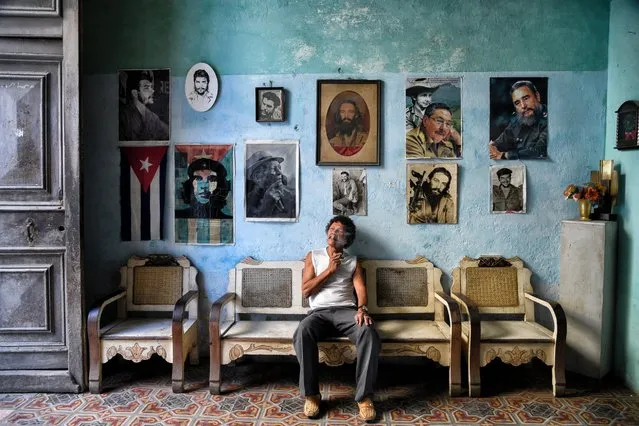 The Wall of Icons. Photographer Romaine W. said, “As I was walking through the streets of Havana I came across this house that looked more like a museum than a regular home. As Cubans are always welcoming to guests, I decided to take a peek inside only to find out that this was actually a home containing collectible items from vinyl records to a large scale American flag, then to this wall of icons; decorated with a Cuban flag, revolutionary fighters, and past and present Cuban leaders”. (Photo by Romaine W./National Geographic Travel Photographer of the Year Contest)
