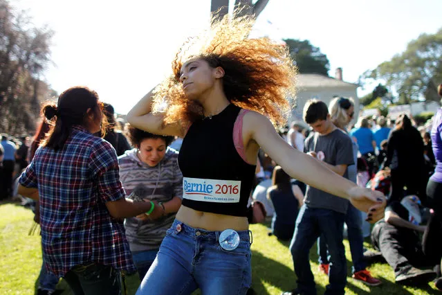 Bernie Sanders supporter Drew Rainer dances prior to the U S. Democratic presidential candidate's campaign rally at Colton Hall in Monterey, California, U.S., May 31, 2016. (Photo by Michael Fiala/Reuters)