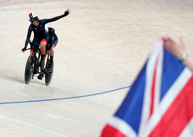 Elizabeth Jordan of Britain and pilot Dannielle Khan react after competing in the women's B 1000m time trial final in Montigny-le-Bretonneux, France on August 30, 2024. (Photo by Gonzalo Fuentes/Reuters)