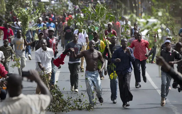 Opposition demonstrators calling for the disbandment of the electoral commission over allegations of bias and corruption, protest in downtown Nairobi, Kenya Monday, June 6, 2016. (Photo by Ben Curtis/AP Photo)