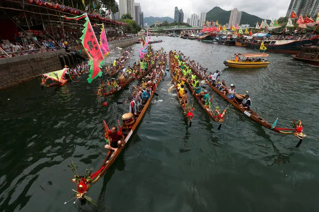 Dragon boats get together during a ceremony in between races during Tung Ng or Dragon Boat Festival at Aberdeen fishing port in Hong Kong June 9, 2016. (Photo by Bobby Yip/Reuters)