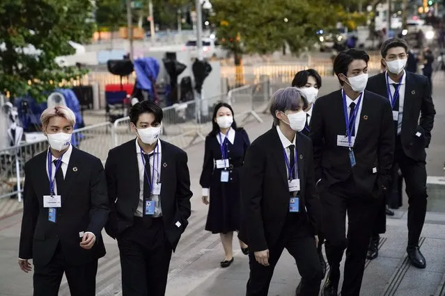 Members of the South Korean band BTS, from left, J-Hope, Jung Kook, Suga, Jimin, partially obscured, Jin and RM arrive to security check-in at United Nations headquarters, Monday, September 20, 2021, during the 76th Session of the U.N. General Assembly in New York. In his General Assembly opening address on Tuesday, U.N. Secretary-General Antonio Guterres practically scolded world leaders for disappointing young people with a perceived inaction on climate change, inequalities and the lack of educational opportunities, among other issues important to young people. (Photo by John Minchillo/AP Photo/Pool)