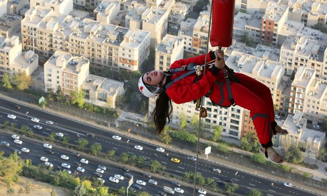 A view of the world's highest 280-meter bungee jumping platform opened at the Milad Tower, a landmark in the Iranian capital Tehran, on September 11, 2024. The world's highest bungee jumping platform attracts great interest among the younger generation in Iran, especially women. Those who jump from the platform experience an unforgettable adventure with the thrill of soaring down from a height of 280 meters while watching the view of Tehran from above. (Photo by Fatemeh Bahrami/Anadolu via Getty Images)