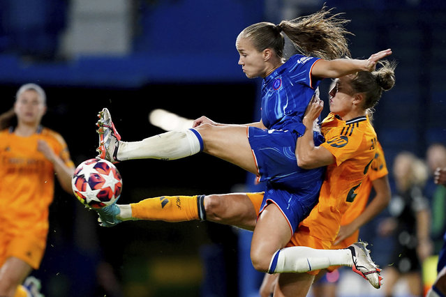 Chelsea's Guro Reiten, front, has a shot on goal during the women's Champions League group B soccer match between FC Chelsea and Real Madrid in London, England, Tuesday, October 8, 2024. (Photo by Zac Goodwin/PA Wire via AP Photo)