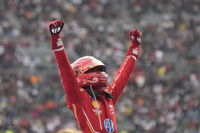 Ferrari driver Carlos Sainz of Spain celebrates after winning the Formula One Mexico Grand Prix auto race at the Hermanos Rodriguez racetrack in Mexico City, Sunday, October 27, 2024. (Photo by Moises Castillo/AP Photo)