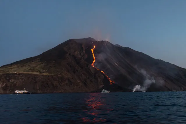 Hot lava trickles down from the Stromboli volcano on August 9, 2014 in Aeolian Islands, Italy. Lava flows down the Mount Stromboli off the Sicilian coast in southern Italy. The volcano – at 3,034ft – is one of the most active in Europe and has been erupting continuously since 1932. (Photo by Tom Pfeiffer/Barcroft Media)