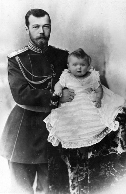 Nicholas II, Tsar of Russia (1868–1918), with his baby daughter, the Grand Duchess Olga Nicolaievna (1895–1918), circa 1895.