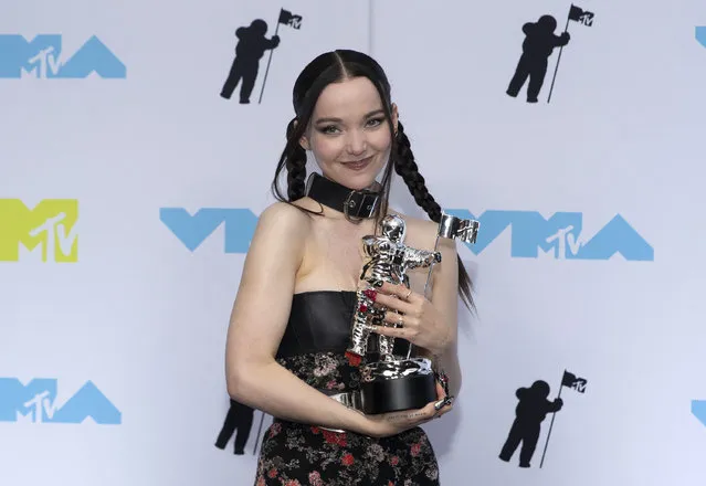 US singer Dove Cameron presents the Best new artist award at the press room during the MTV Video Music Awards at the Prudential Center in Newark, New Jersey on August 28, 2022. (Photo by Andres Kudacki/AFP Photo)