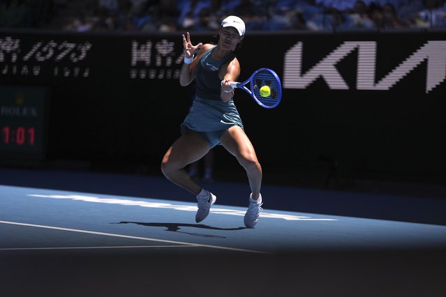 Wang Xiyu of China plays a forehand return to Emma Navarro of the U.S. during their second round match at the Australian Open tennis championship in Melbourne, Australia, Thursday, January 16, 2025. (Photo by Ng Han Guan/AP Photo)