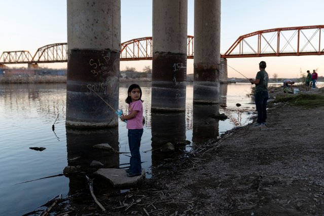 A young girl fishes in the Rio Grande River in Piedras Negras, Coahuila, Mexico, on January 18, 2025. (Photo by Cheney Orr/Reuters)