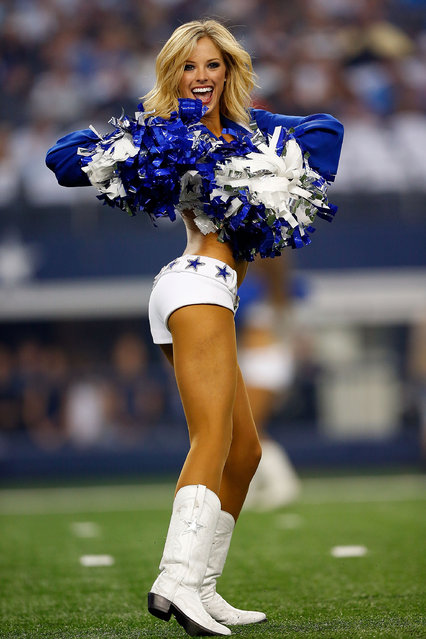 Dallas Cowboys Cheerleaders perform during the preseason game against the Baltimore Ravens at AT&T Stadium on August 16, 2014 in Arlington, Texas. (Photo by Tom Pennington/Getty Images)