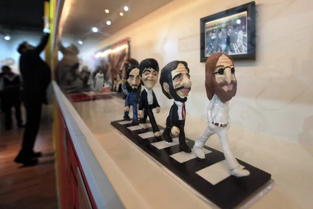 A general view shows figurines of The Beatles band members inspired by the cover of their studio album Abbey Road, displayed during “The Beatles. Yesterday, Today and Tomorrow. The Maturity (1965-1967)” exhibition at Museum Soumaya in Mexico City, Mexico, 18 August 2016. For the second year in a row the museum hosts the exhibition dedicated to the The Beatles, gathering hundreds of collective objects of the band from Liverpool. (Photo by Sashenka Gutierrez/EPA)