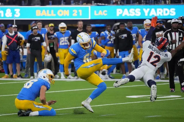 Los Angeles Chargers place kicker Dustin Hopkins (6) kicks a 39-yard fielg goal out of the hold of punter JK Scott (16) in overtime against the Denver Broncos at SoFi Stadium in Inglewood, California on October 17, 2022. (Photo by Kirby Lee/USA TODAY Sports)