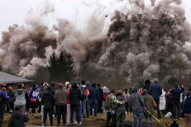 Wyndford flats are demolished during a controlled explosion on March 23, 2025 in Glasgow, Scotland. Four 26-storey residential tower blocks at Wyndford Road in North Glasgow are being brought down to make way for a redevelopment plan that will see nearly four hundred new homes and a community hub built in the area. Three of the four 1960's era towers are being demolished with explosives, while a fourth is being dismantled manually. (Photo by Jeff J. Mitchell/Getty Images)