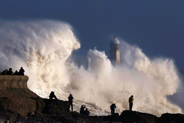 People view large waves as Storm Eowyn arrives, in Porthcawl, Wales, Britain, on January 24, 2025. (Photo by Toby Melville/Reuters)