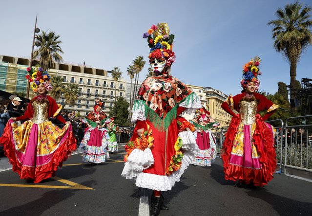 Participants wearing a colorful costumes take part in the Flowers Parade of the 151th annual Carnival of Nice, in Nice, France, 20 March 2024. The annual Carnival of Nice run from 17 February to 03 March 2024, and the main theme will be “King of Pop Culture”. (Photo by Sebastien Nogier/EPA)