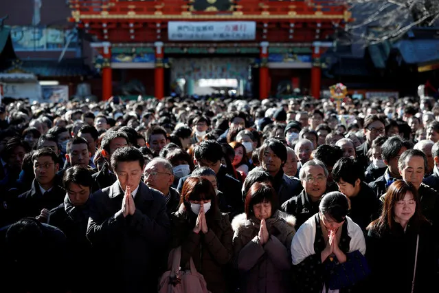 People offer prayers on the first business day of the year at the Kanda Myojin shrine, which is known to be frequented by worshippers seeking good luck and prosperous business, in Tokyo, Japan, January 4, 2018. (Photo by Issei Kato/Reuters)
