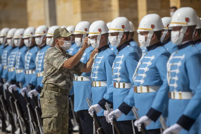 Ceremonial soldiers, wearing masks as a precautionary measure against the novel coronavirus (Covid-19), perform at Anitkabir, the mausoleum of Turkish Republic founder Mustafa Kemal Ataturk, to mark the 98th Anniversary of Turkeyâs Victory Day, a key Turkish defeat of Greek forces in the countryâs War of Independence 1919-1922, and Turkish Armed Forces Day, in Ankara, Turkey on August 30, 2020. (Photo by Aytac Unal/Anadolu Agency via Getty Images)