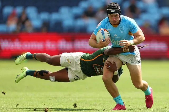 Eugenio Plottier of Uruguay is tackled by Darren Adonis of South Africa during the 2023 Sydney Sevens match between South Africa and Uruguay at Allianz Stadium on January 28, 2023 in Sydney, Australia. (Photo by Mark Metcalfe/Getty Images)