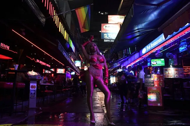 Transgender drag queen Aunchalee Pokinwuttipob, better known by the stage name, Angele Anang, 26, stands outside The Stranger bar to promote her show, in Silom district, Bangkok, Thailand, September 18, 2020. (Photo by Chalinee Thirasupa/Reuters)