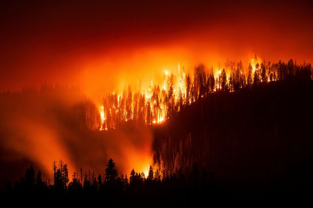 This long exposure photograph shows the Garnet fire burning in the Sierra National Forest, Calif., on Monday, September 8, 2025. (Photo by Noah Berger/AP Photo)