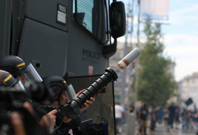 French CRS riot police launch a tear gas canister during a demonstration, as part of a grassroots protest movement called "Bloquons Tout" ("Let's Block Everything") calling for nationwide all-day disruption, in Montpellier, France, on September 10, 2025. (Photo by Manon Cruz/Reuters)
