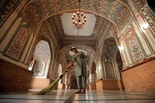 A boy cleans a mosque ahead of the holy fasting month of Ramadan in Peshawar, Pakistan, 21 March 2023. Muslims around the world celebrate the holy month of Ramadan, by praying during the night time and abstaining from eating, drinking, and sexual acts during the period between sunrise and sunset. Ramadan is the ninth month in the Islamic calendar and it is believed that the revelation of the first verse in Koran was during its last 10 nights. (Photo by Bilawal Arbab/EPA)