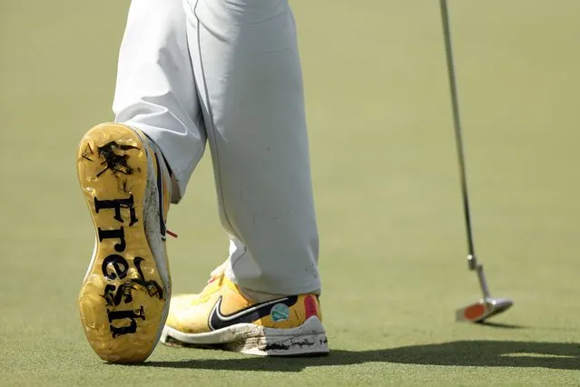 A detail of Brooks Koepka of the United States shoes on the 18th green during the continuation of the weather delayed third round of the 2023 Masters Tournament at Augusta National Golf Club on April 09, 2023 in Augusta, Georgia. (Photo by Patrick Smith/Getty Images)