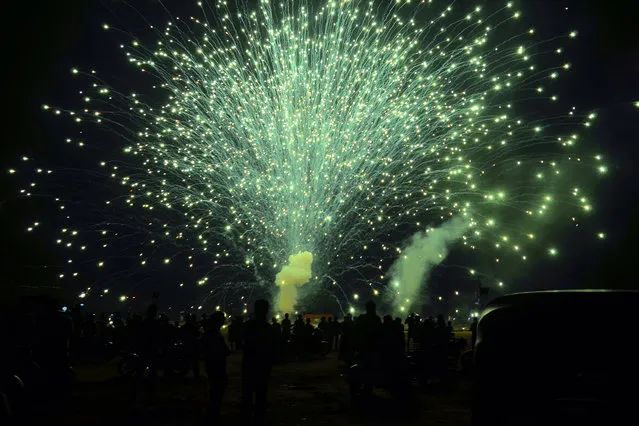 Kollam, India. 31st December 2014 – Traditional firework were launched in honor of New Year's Eve and to welcome in 2015 in Kollam, India. (Photo by Haris Crayon/Demotix)